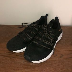 Gently used black and gold/bronze puma shoes
